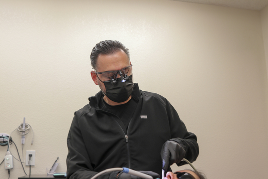 A patient has her teeth cleaned